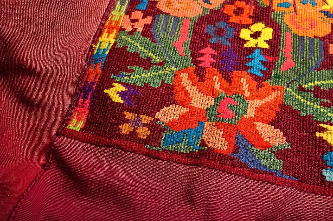 How did traditional embroidery patterns preserve women’s stories in rural societies?